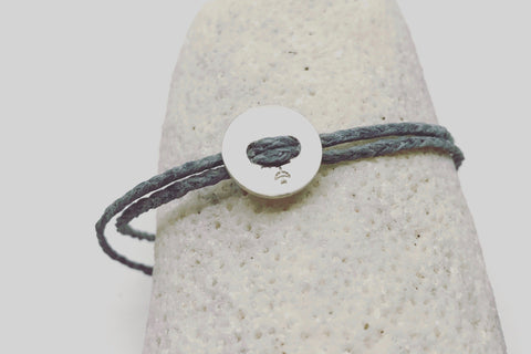 Silver button (12mm) against grey linen waxed cord