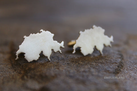 Map cufflinks shown in sterling silver with matte finish and Switzerland border