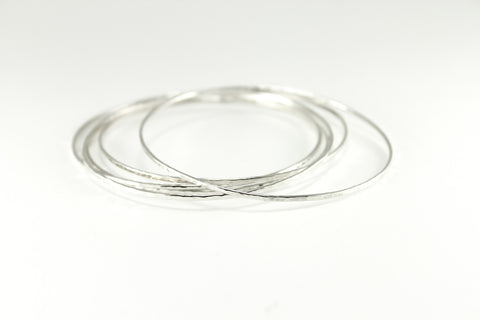 Sterling SIlver Hammered Solo Bangles. Approximately 1.25mm wide and thick.
