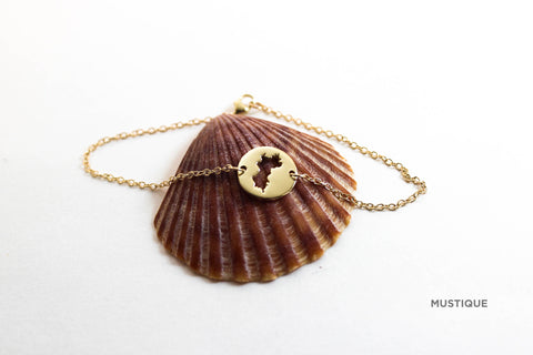 Mini (12mm)10K gold medallion with matching bracelet and Mustique border.